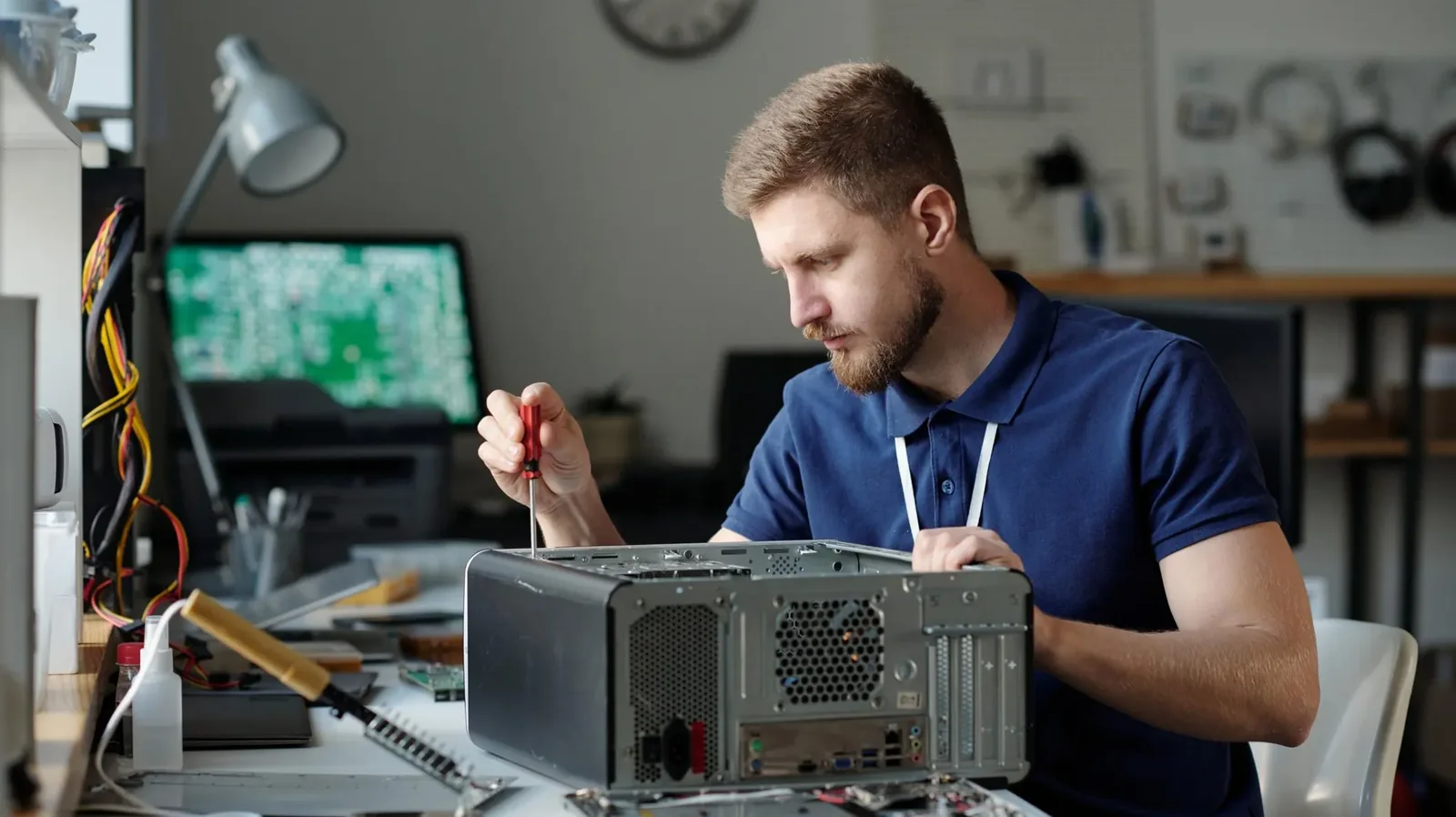 On-site technician servicing a business computer workstation